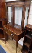 A small Edwardian satinwood banded mahogany cabinet on stand W.65cm