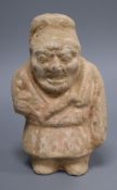 A Chinese polychrome pottery figure of a dwarf, Han dynasty