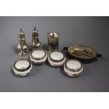 Three silver condiments, four white metal mounted ceramic salts with spoons and a mounted dish.