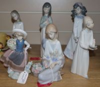 Six Lladro figures of girls with flowers and candles