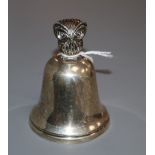 A silver hand bell with owl finial, Wakely & Wheeler, London, 1958 84mm.