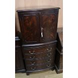 A reproduction mahogany bowfront cabinet W.61cm