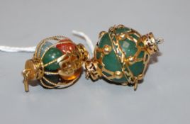 Two 14k yellow metal and gem set pendants, one containing beads, two of which are plastic