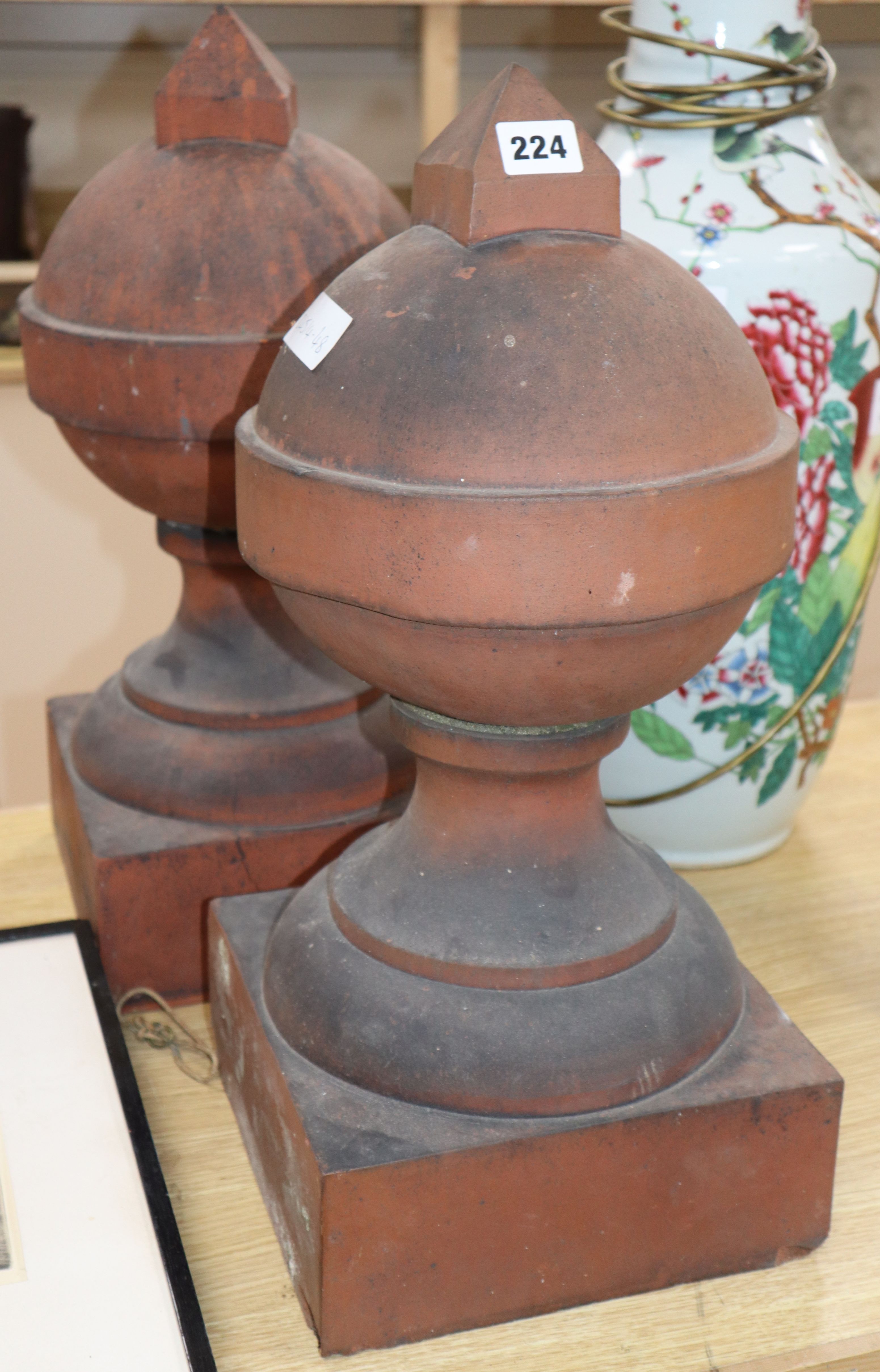 A pair of terracotta finials, H.53cm