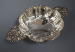 An early 20th century Dutch embossed silver lobed quaich, import marks for Samuel Boyce Landeck,