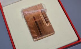 A cased Dupont lighter