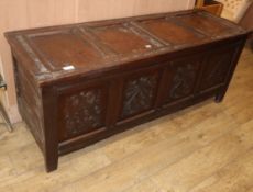 A 17th century panelled oak coffer W.165cm