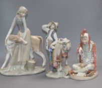 A Lladro figure of a jester, a typical pedlar and a girl with calf tallest 33cm