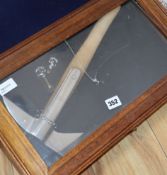 A 20th century Kent Fire Brigade fireman's axe, cased, with badges (case a.f.)