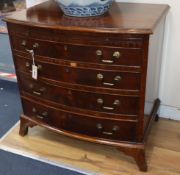 A George III style mahogany bow fronted chest, fitted four long drawers and a brushing slide W.76cm