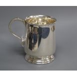 A 1970's silver christening mug and cased silver ashtray.