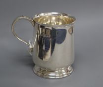 A 1970's silver christening mug and cased silver ashtray.