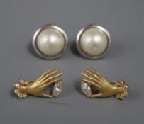 A pair of 750 yellow metal 'hand' earrings and a pair of 9ct. and mabe pearl earrings.