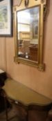 A Victorian gilt framed wall mirror, with a serpentine fronted console table (2) Mirror 104cm high