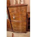 A George III style bow fronted walnut chest on chest W.72cm