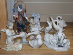 A Lladro figure of Puss in Boots, figure group of three polar bears, Baby Blanket, Sleeping Child,