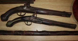 A Continental brass mounted flintlock pistol and another pistol and a rifle rifle 170cm