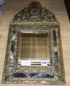 A French brass overlaid cushion wall mirror length 59cm