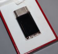 A boxed Cartier lighter, with paperwork