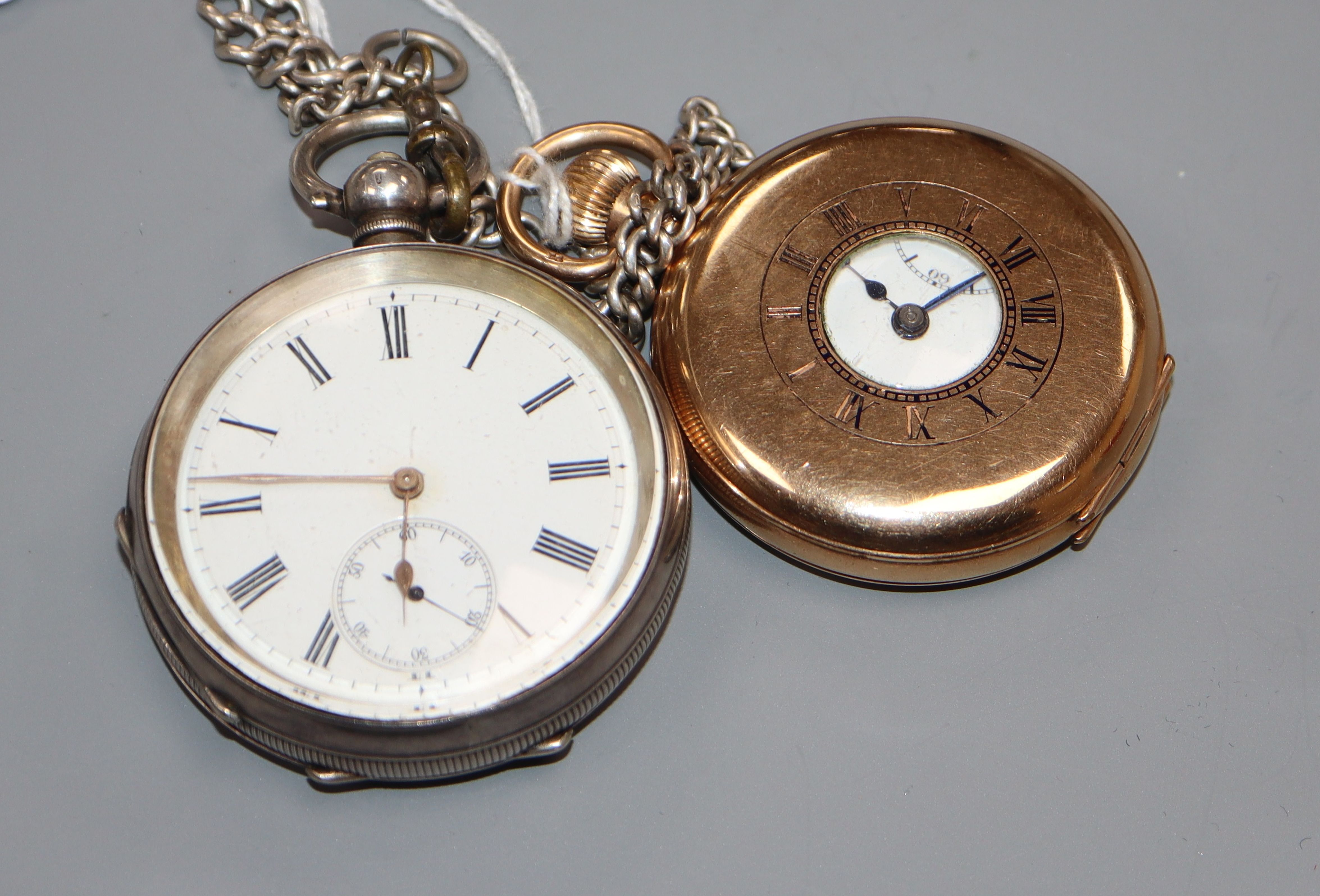 A gold plated half hunter pocket watch and a silver face pocket watch and chain.