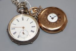 A gold plated half hunter pocket watch and a silver face pocket watch and chain.