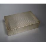 A George V ribbed silver rectangular cigarette box by Mappin & Webb, London, 1933 (handle missing?),