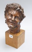 A French carved head of a faun, signed M. Malon