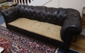 An early 20th century buttoned brown leather chesterfield settee L.194cm