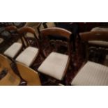 A set of four William IV rosewood dining chairs