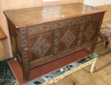 An early 18th century carved oak coffer W.117cm