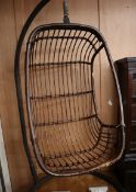 A bamboo hanging pod chair on iron frame H.176cm