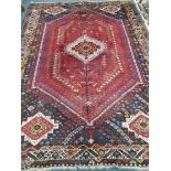 A Shiraz carpet 310 x 216cm