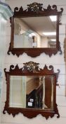 A pair of George III style mahogany fret cut wall mirrors with gilt carved eagle pediments W.58cm