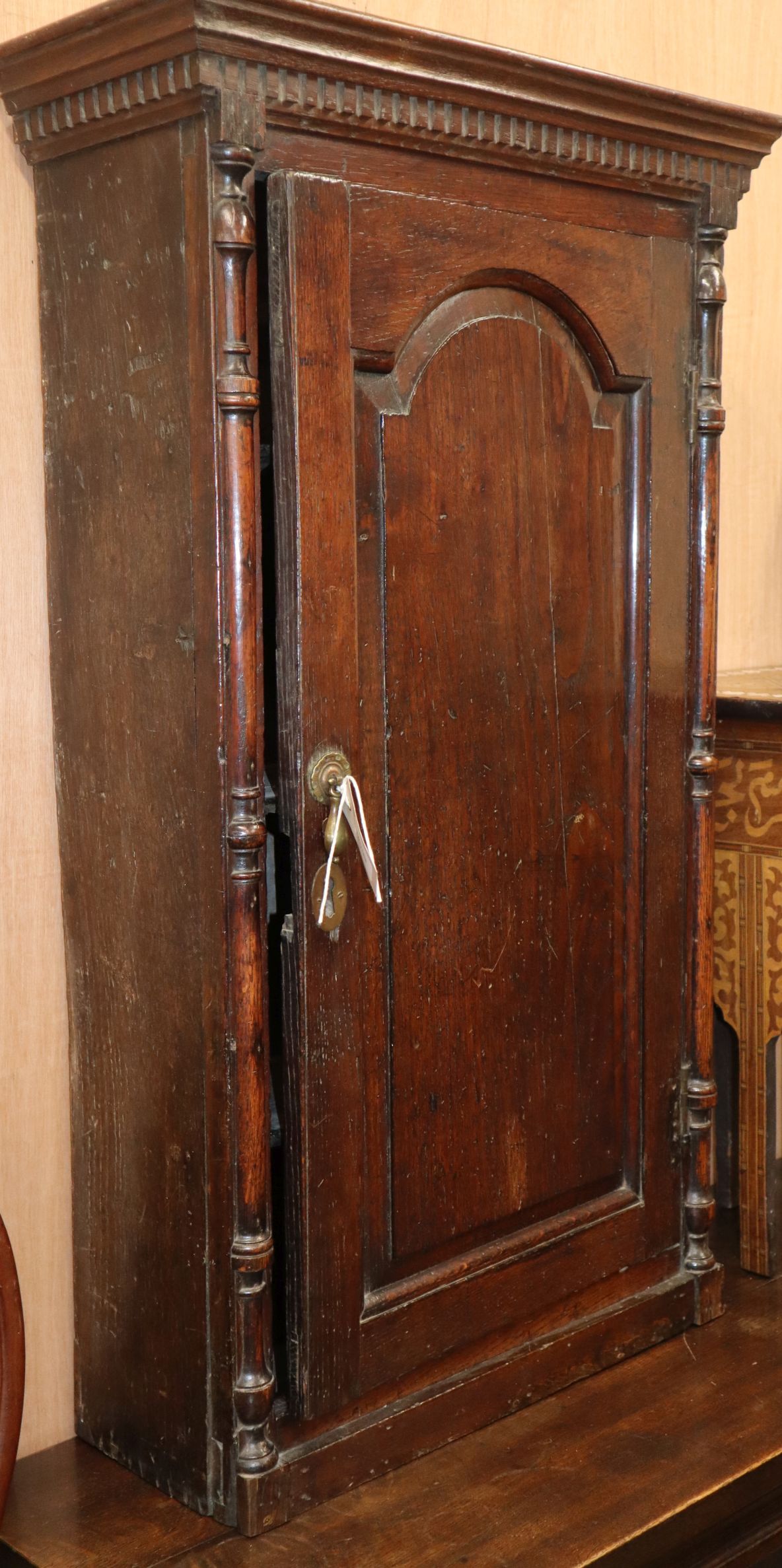 An 18th century oak hanging wall cupboard H.98cm