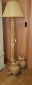 A pair of turned wood table lamps and a turned wood lamp standard (3)