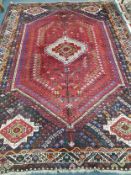 A Shiraz carpet 310 x 216cm