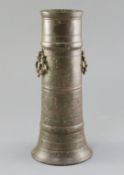 A 17th century Indian bronze vase, with pierced ring handles and ring turned decoration, lacks base,