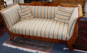 A 19th century Biedermeier satin birch settee, with striped upholstery L.180cm