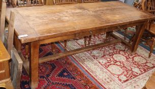 A 19th century French farmhouse extending kitchen dining table, fitted two mid drawers, with one