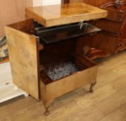 A 1930's walnut veneered cocktail cabinet, fitted with a part suite of vine etched drinking