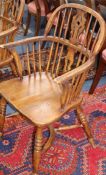 A set of eight ash and beech hoop back elbow chairs, with crinoline stretchers