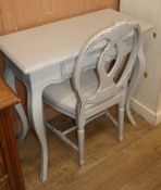 A pair of French provincial style painted small dressing tables and a pair of painted chairs