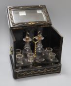 A 19th century French liqueur casket, fitted decanters and glasses (one a.f.) height 24cm