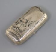 A 19th century Russian 84 zolotnik small silver and niello cigarette case, decorated with a soldier,