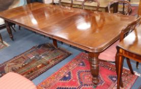 A mid Victorian mahogany extending dining table, with four spare leaves 275cm extended