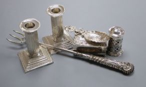 A pair of Edwardian silver dwarf candlesticks, Sheffield, 1903, a silver pepperette, Dutch silver