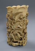 A 19th century Chinese ivory vase, carved in high relief with birds an insects amid flower and