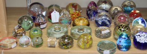 A collection of mixed paperweights