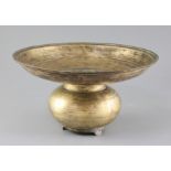 A 17th century Indian bronze spittoon, with bulbous base and three feet, diameter 13in. height 7.