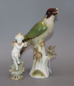 A Meissen porcelain woodpecker and a porcelain angel tallest 27m (both a.f.)